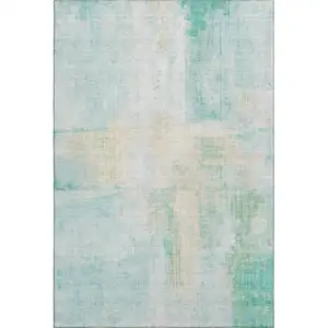 Photo of Teal And Ivory Abstract Washable Area Rug With UV Protection