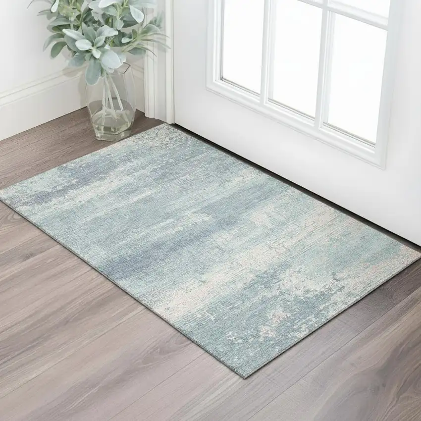 Teal And Ivory Abstract Washable Area Rug With UV Protection Photo 2