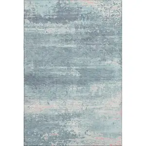 Photo of Teal And Ivory Abstract Washable Area Rug With UV Protection