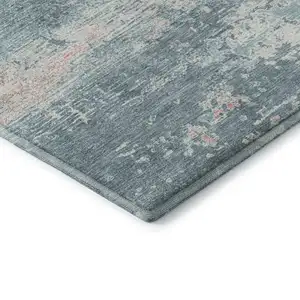 Photo of Teal And Ivory Abstract Washable Area Rug With UV Protection
