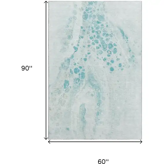 Teal And Ivory Abstract Washable Area Rug With UV Protection Photo 9