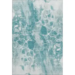 Photo of Teal And Ivory Abstract Washable Area Rug With UV Protection