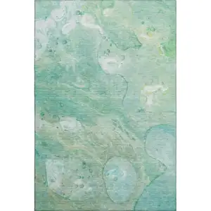 Photo of Teal And Ivory Abstract Washable Area Rug With UV Protection