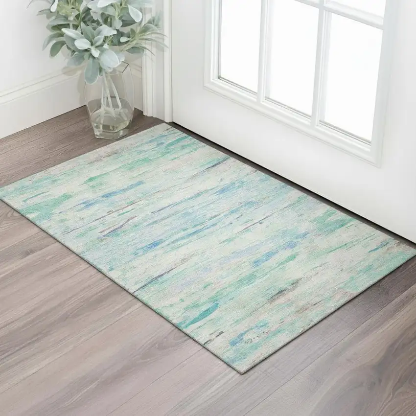 Teal And Ivory Abstract Washable Area Rug With UV Protection Photo 2