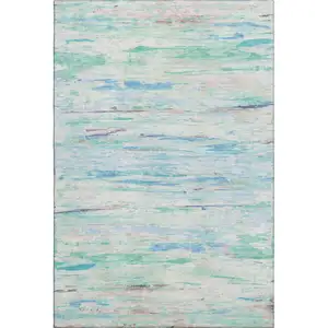Photo of Teal And Ivory Abstract Washable Area Rug With UV Protection