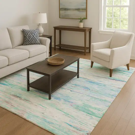 Teal And Ivory Abstract Washable Area Rug With UV Protection Photo 6