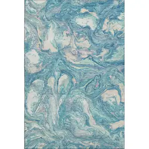 Photo of Teal And Ivory Abstract Washable Area Rug With UV Protection