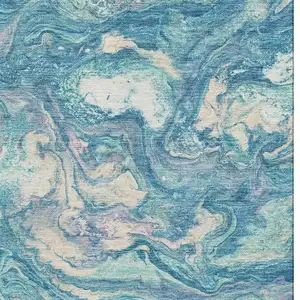 Photo of Teal And Ivory Abstract Washable Area Rug With UV Protection