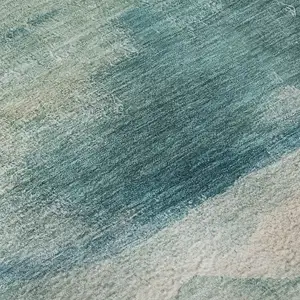 Photo of Teal And Ivory Abstract Washable Area Rug With UV Protection