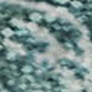 Photo of Teal And Ivory Abstract Washable Area Rug With UV Protection