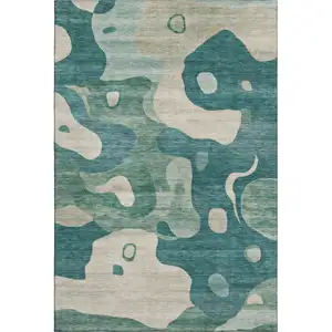Photo of Teal And Ivory Abstract Washable Area Rug With UV Protection