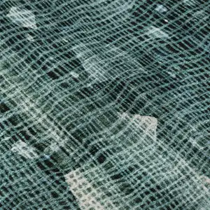 Photo of Teal And Ivory Abstract Washable Area Rug With UV Protection