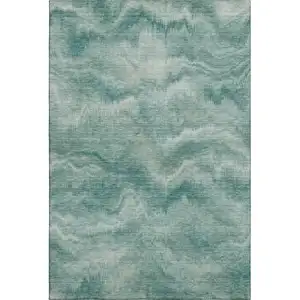 Photo of Teal And Ivory Abstract Washable Area Rug With UV Protection