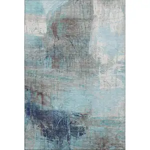 Photo of Teal And Ivory Abstract Washable Area Rug With UV Protection