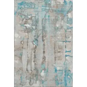 Photo of Teal And Ivory Abstract Washable Area Rug With UV Protection