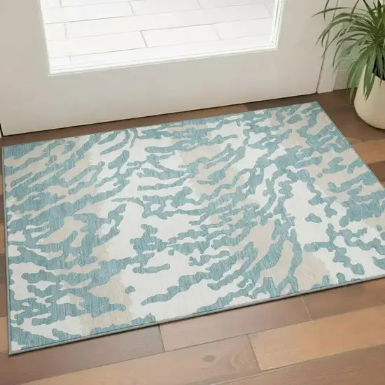 Teal And Ivory Animal Print Washable Area Rug With UV Protection Photo 1