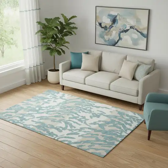 Teal And Ivory Animal Print Washable Area Rug With UV Protection Photo 1