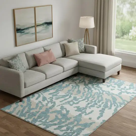 Teal And Ivory Animal Print Washable Area Rug With UV Protection Photo 1