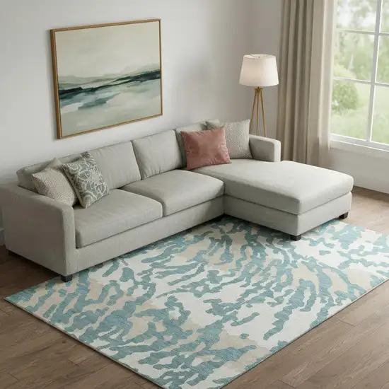 Teal And Ivory Animal Print Washable Area Rug With UV Protection Photo 1