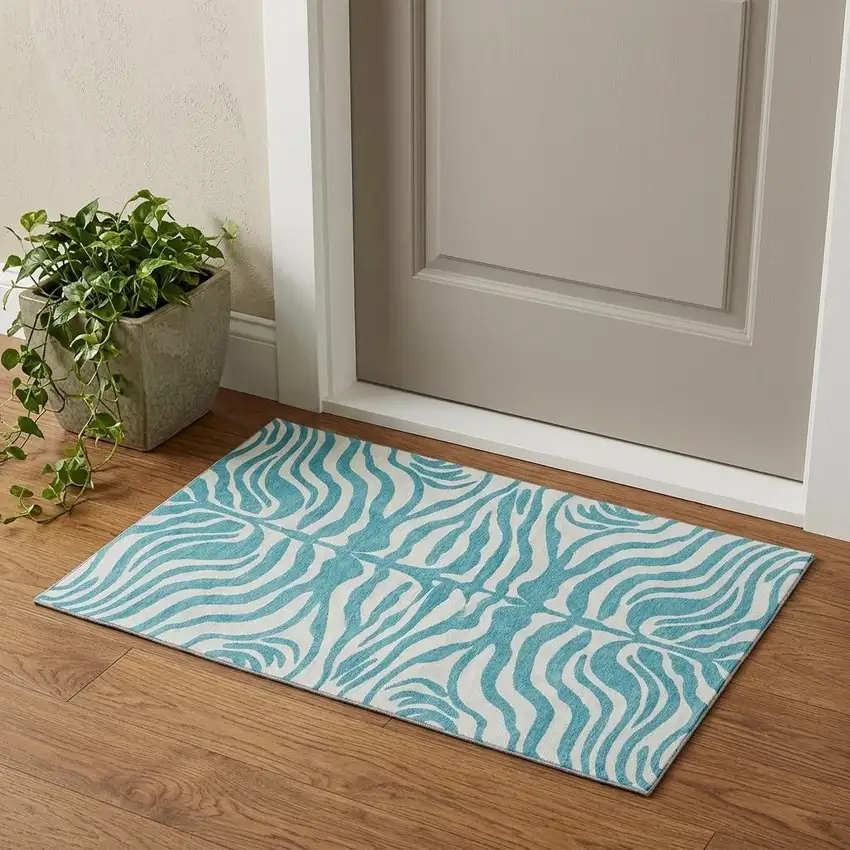 Teal And Ivory Animal Print Washable Area Rug With UV Protection Photo 1