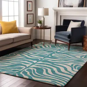 Photo of Teal And Ivory Animal Print Washable Area Rug With UV Protection