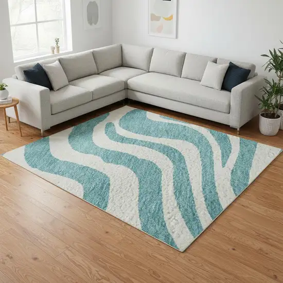 Teal And Ivory Animal Print Washable Area Rug With UV Protection Photo 2
