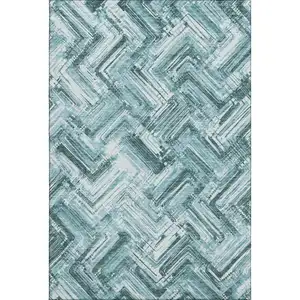 Photo of Teal And Ivory Chevron Washable Area Rug With UV Protection