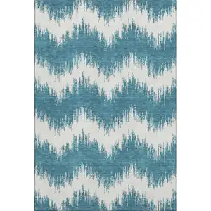 Photo of Teal And Ivory Chevron Washable Area Rug With UV Protection