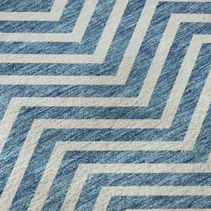 Photo of Teal And Ivory Chevron Washable Area Rug With UV Protection