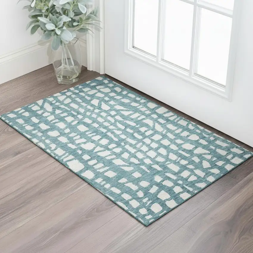 Teal And Ivory Cobblestone Washable Area Rug With UV Protection Photo 1