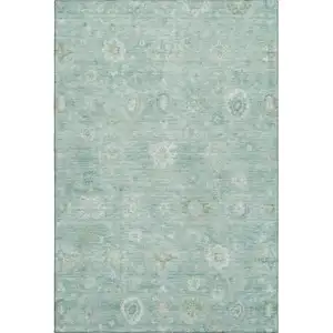 Photo of Teal And Ivory Damask Washable Area Rug With UV Protection