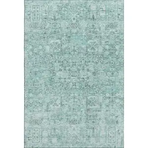 Photo of Teal And Ivory Floral Washable Area Rug With UV Protection