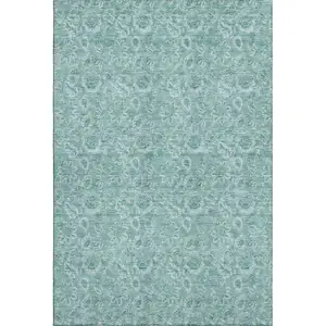 Photo of Teal And Ivory Floral Washable Area Rug With UV Protection