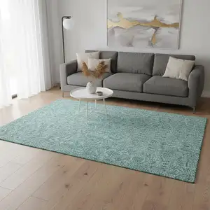 Photo of Teal And Ivory Floral Washable Area Rug With UV Protection