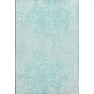 Photo of Teal And Ivory Floral Washable Area Rug With UV Protection