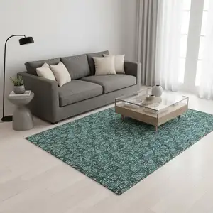 Photo of Teal And Ivory Floral Washable Area Rug With UV Protection