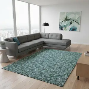 Photo of Teal And Ivory Floral Washable Area Rug With UV Protection