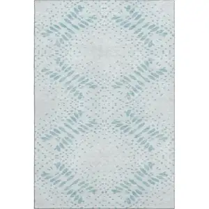 Photo of Teal And Ivory Floral Washable Area Rug With UV Protection