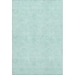 Photo of Teal And Ivory Floral Washable Area Rug With UV Protection