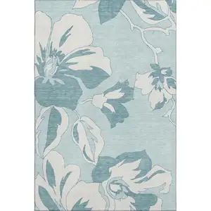Photo of Teal And Ivory Floral Washable Area Rug With UV Protection