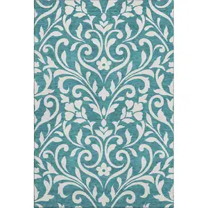 Photo of Teal And Ivory Floral Washable Area Rug With UV Protection