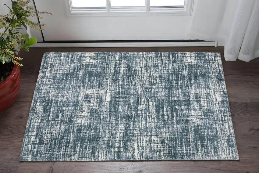 Teal And Ivory Geometric Area Rug Photo 1