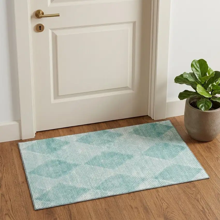 Teal And Ivory Geometric Washable Area Rug With UV Protection Photo 1