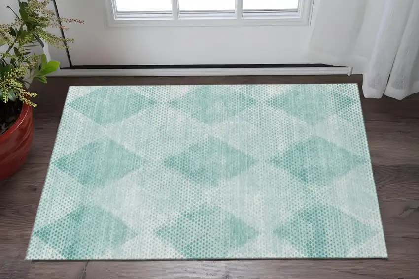 Teal And Ivory Geometric Washable Area Rug With UV Protection Photo 2