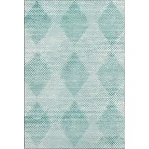 Photo of Teal And Ivory Geometric Washable Area Rug With UV Protection