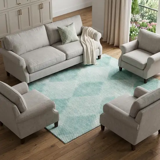 Teal And Ivory Geometric Washable Area Rug With UV Protection Photo 1