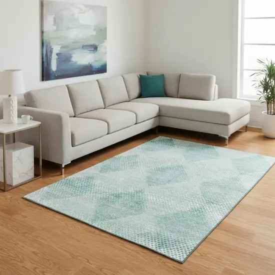 Teal And Ivory Geometric Washable Area Rug With UV Protection Photo 1