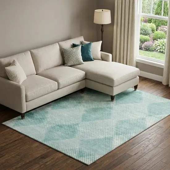 Teal And Ivory Geometric Washable Area Rug With UV Protection Photo 1