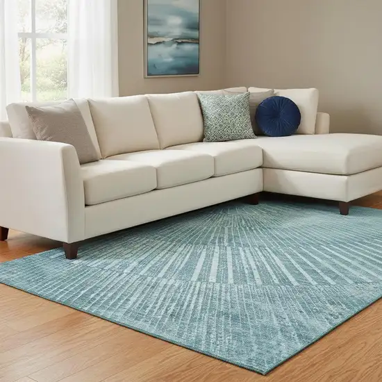 Teal And Ivory Geometric Washable Area Rug With UV Protection Photo 1