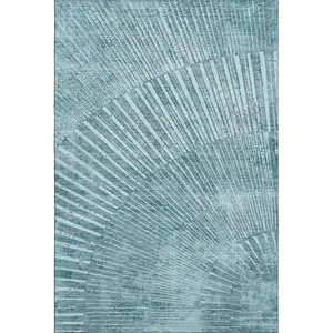 Photo of Teal And Ivory Geometric Washable Area Rug With UV Protection